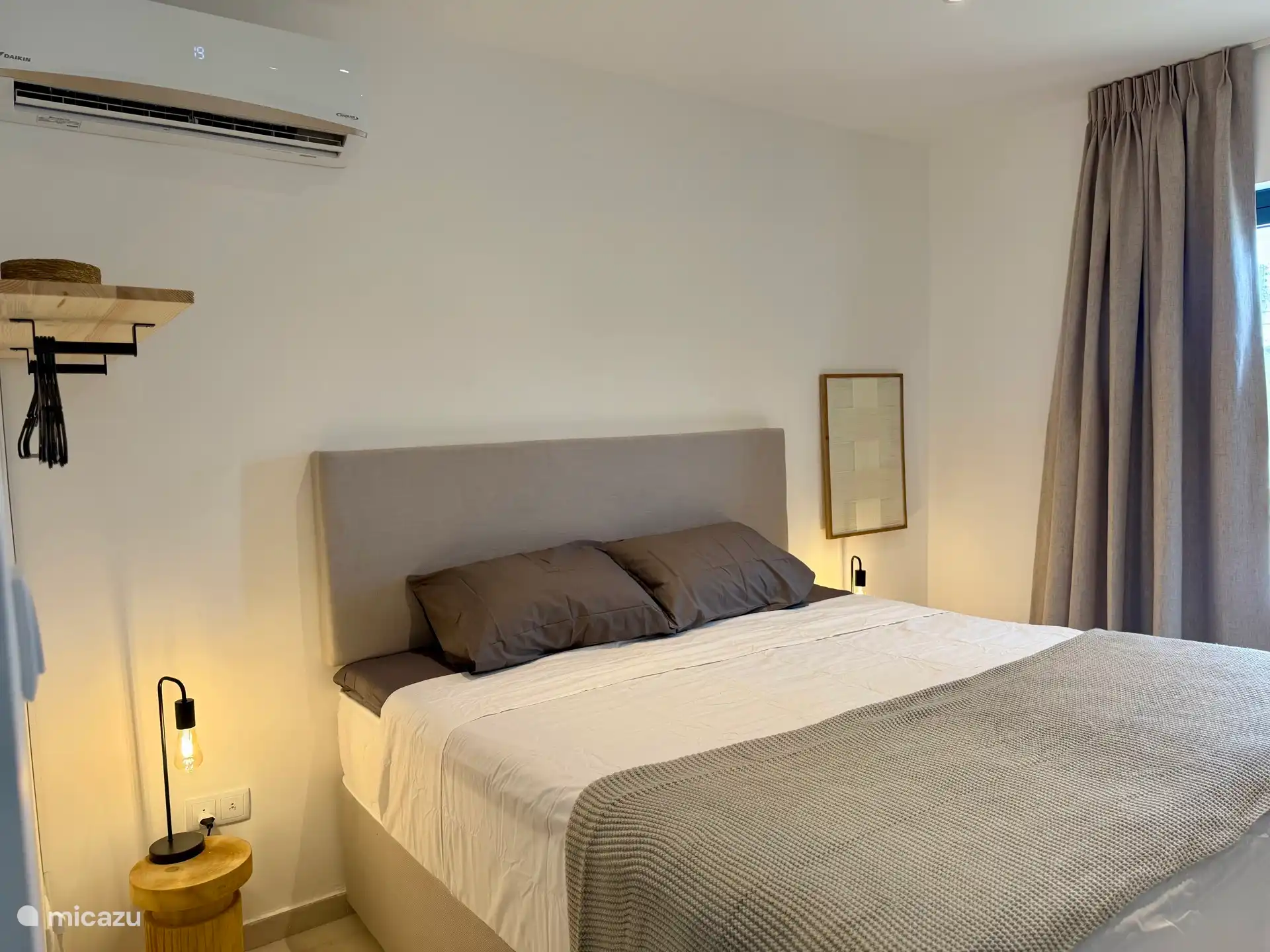 Bedroom 1 downstairs, double bed with private bathroom.