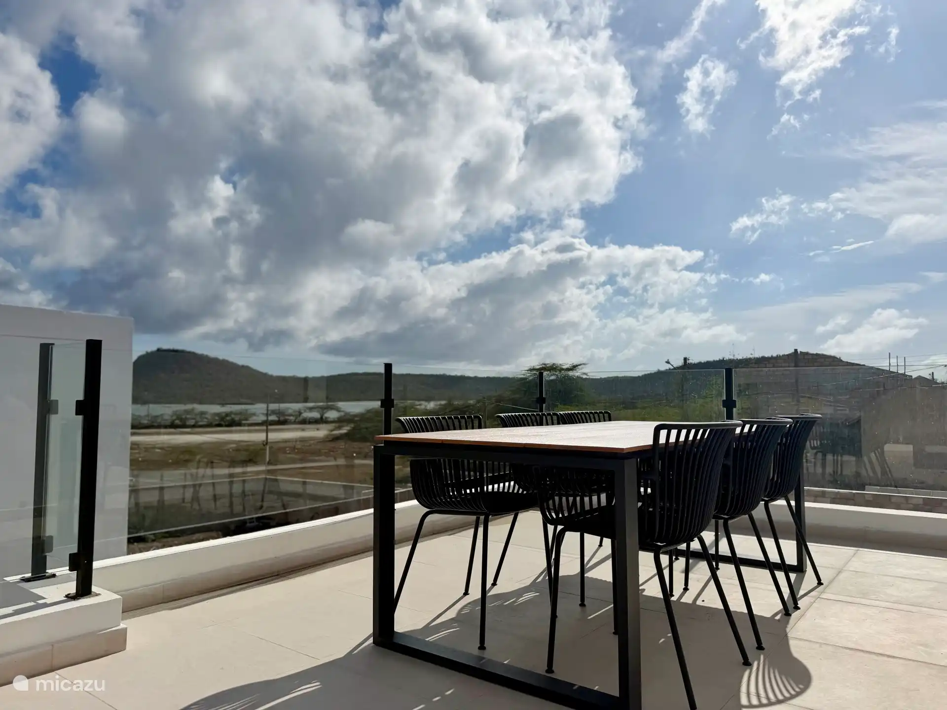 Terrace on the first floor with dining table and 6 dining chairs. 