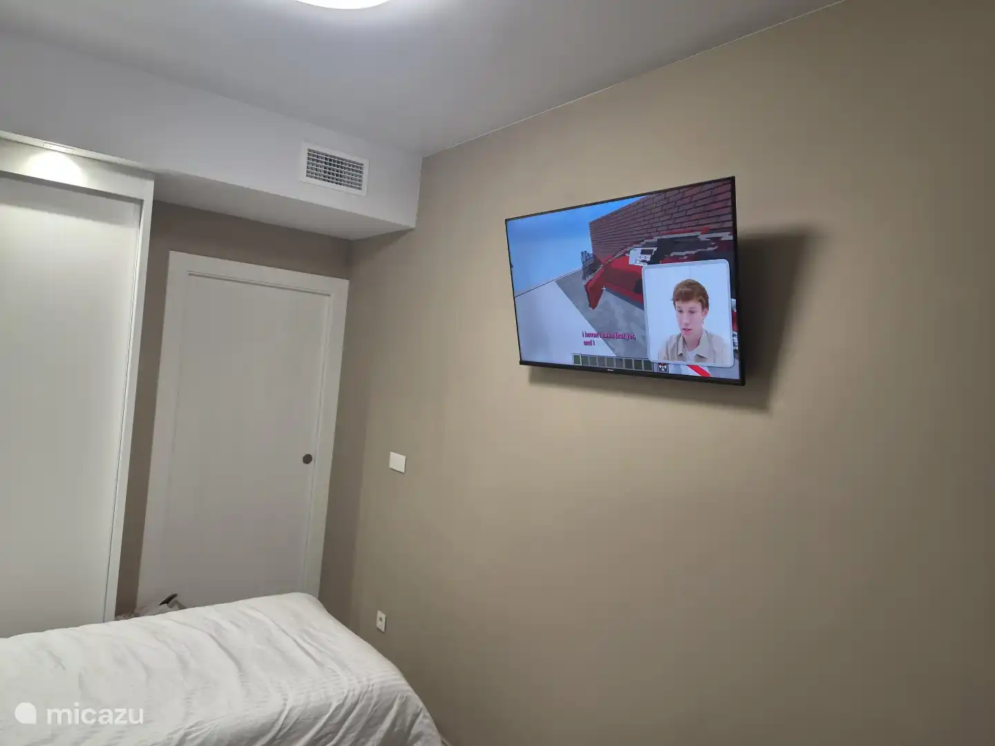 A TV in the second bedroom for the children or to watch series