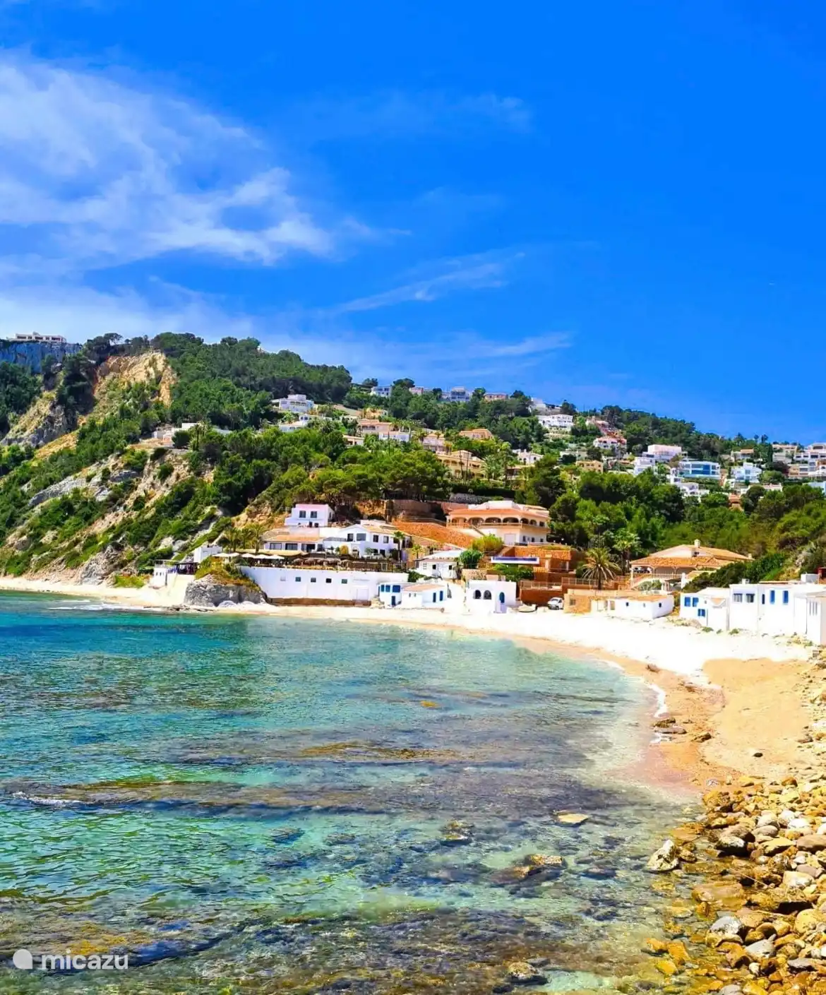 El Portet bay and beach, where you can swim and eat paella.