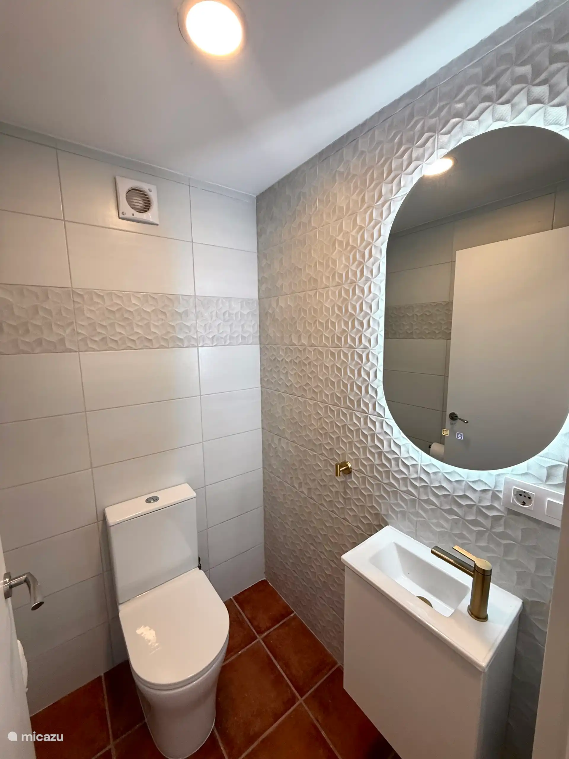 Spacious separate toilet room with extra large door and ventilation.
