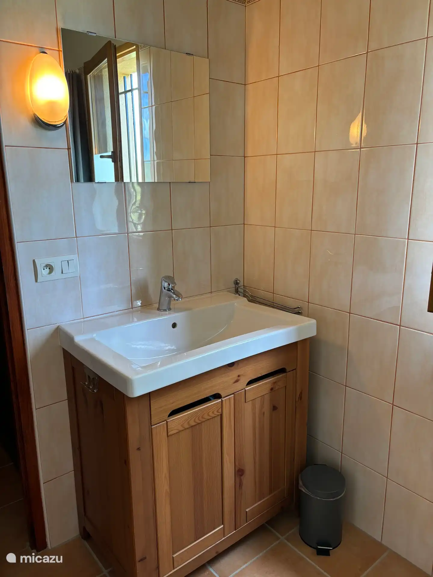 Bathroom with bath and shower, plus a separate adjoining toilet. 