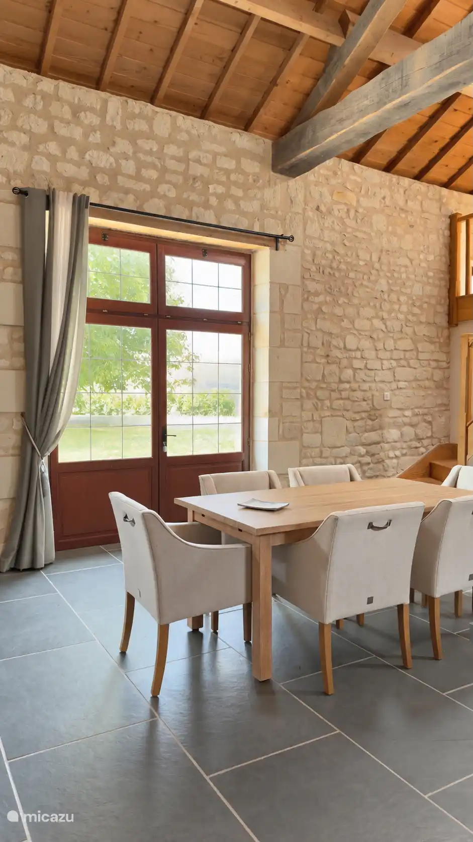 The dining at Walnut View and double doors that opens up to the garden and outlook the walnut tree. 