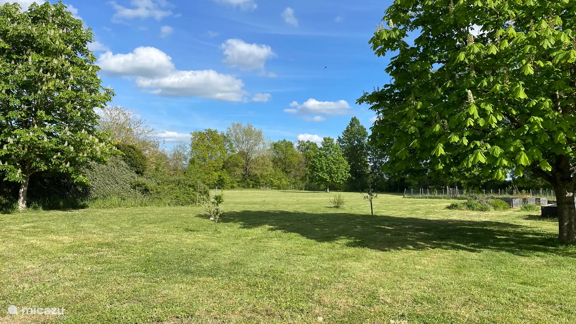 The Garden to the estate with the open field for football or fun. 
