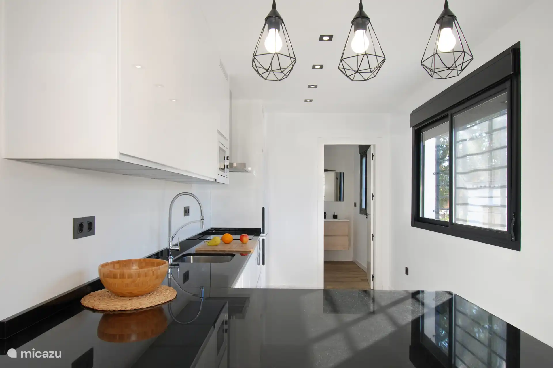 Next to the kitchen is a full bathroom. 