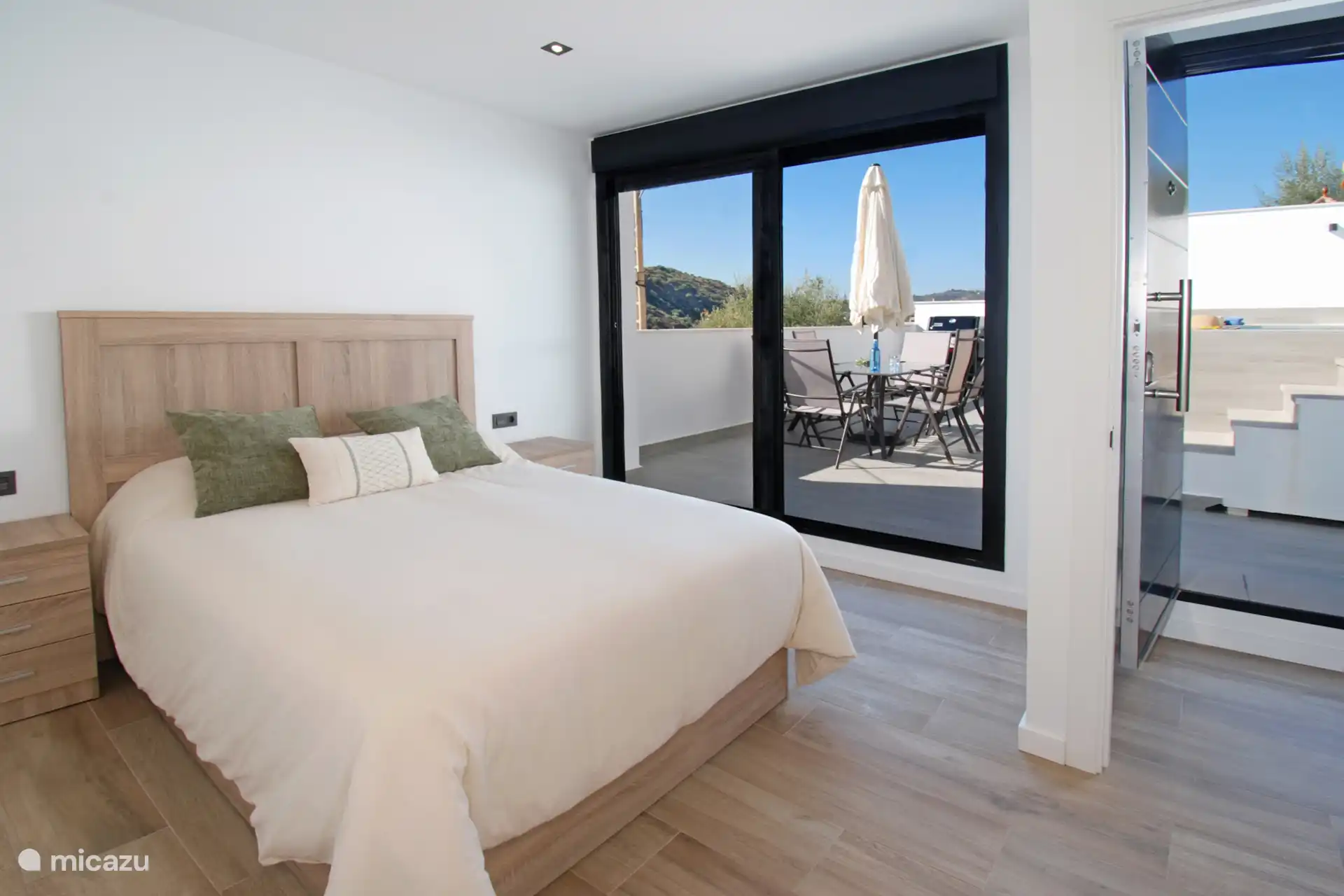 Our master bedroom with en-suite bathroom and direct access to terrace with swimming pool. 