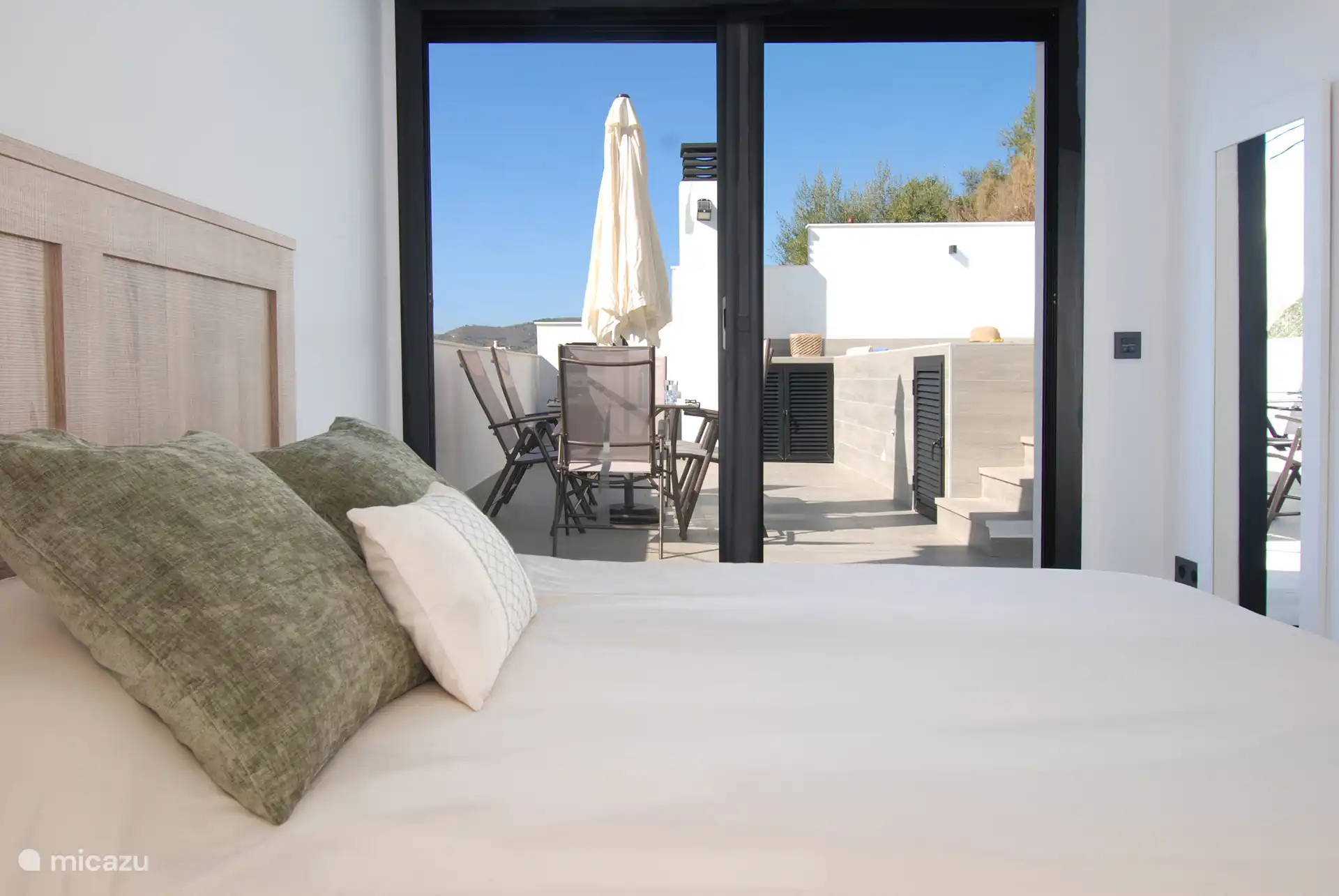 The master bedroom with en-suite bathroom and private access to the terrace.