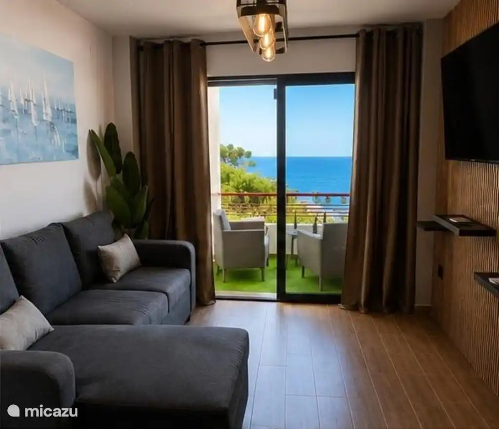 Living area with the sea in the background from the living room