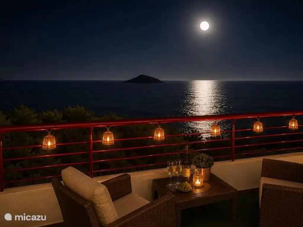 The terrace at night, illuminated and facing the sea