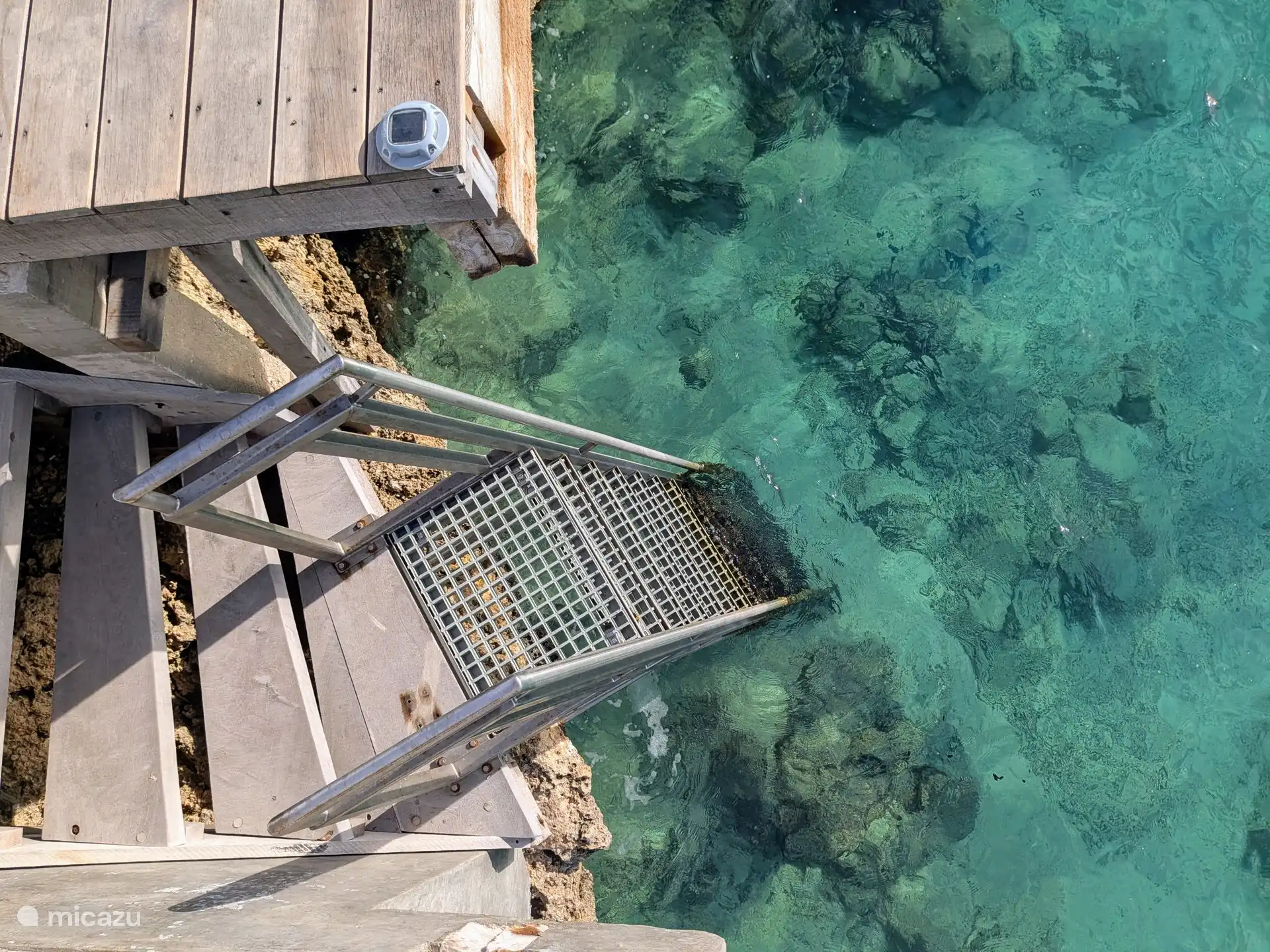 The clear water at the sea entrance of the villa.