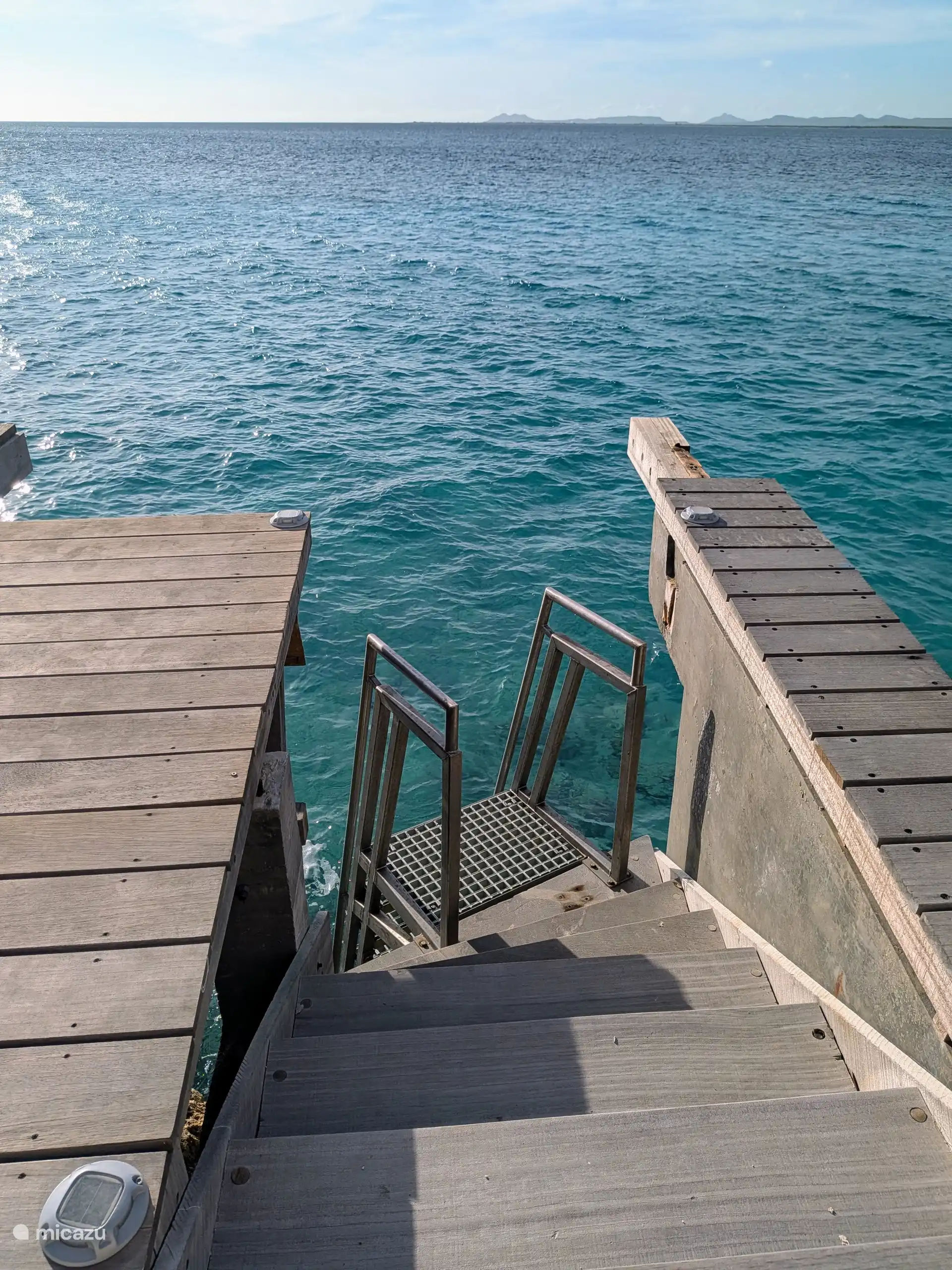 Stairs and swimming ladder from the deck to the sea.