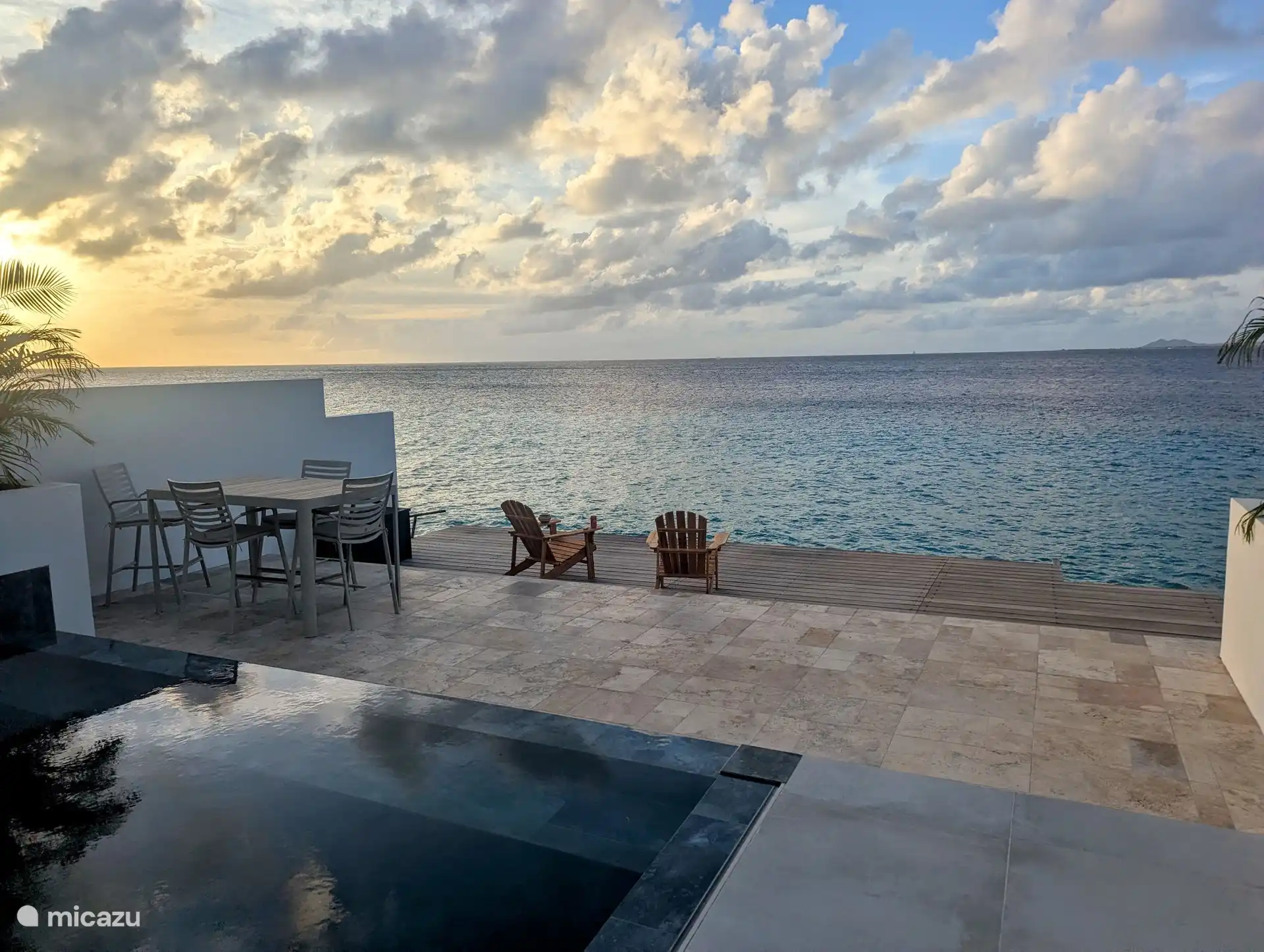Terrace by the sea with a view over the clear waters of Bonaire.