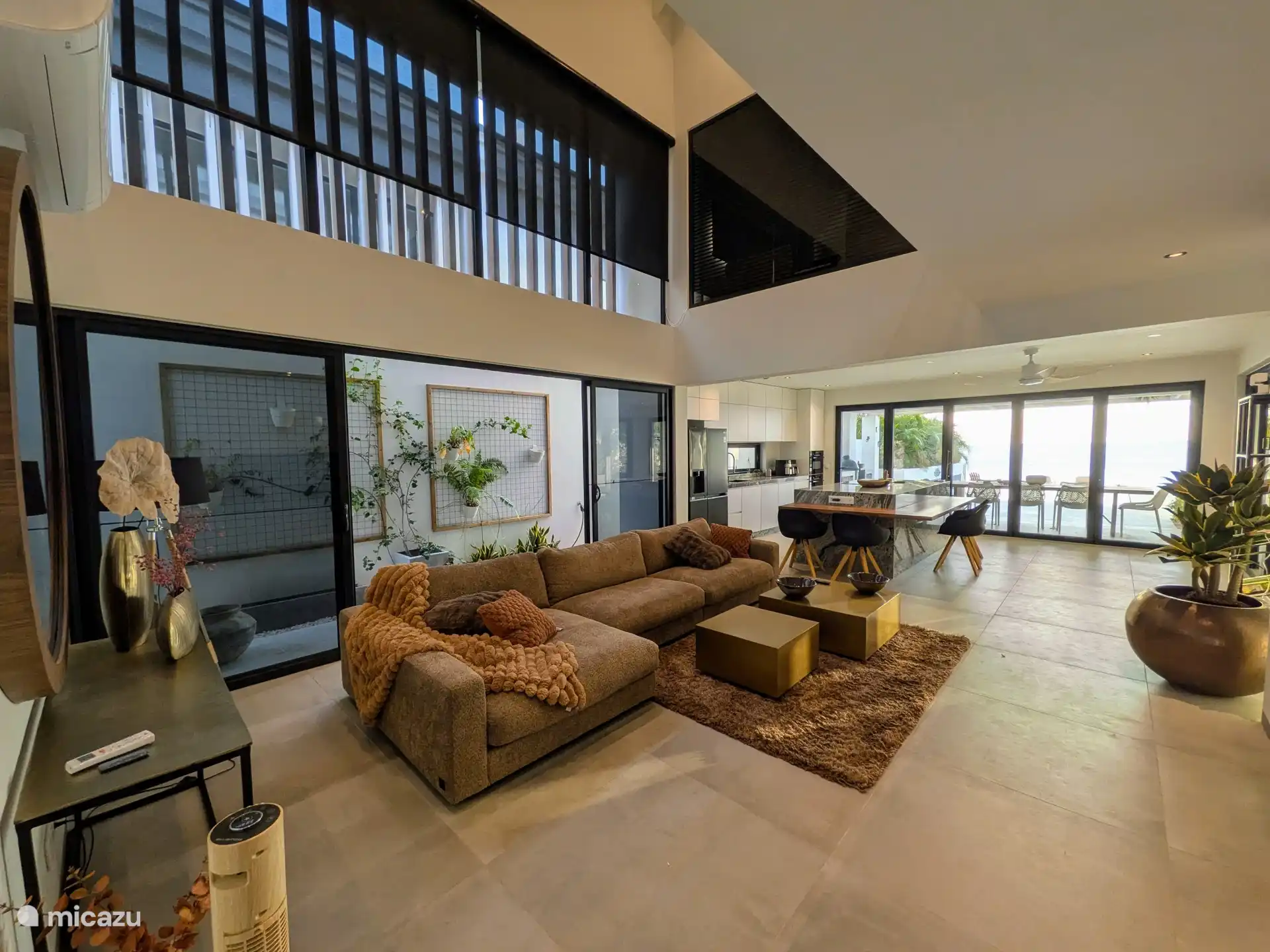 Spacious living room with open landing and high ceilings.