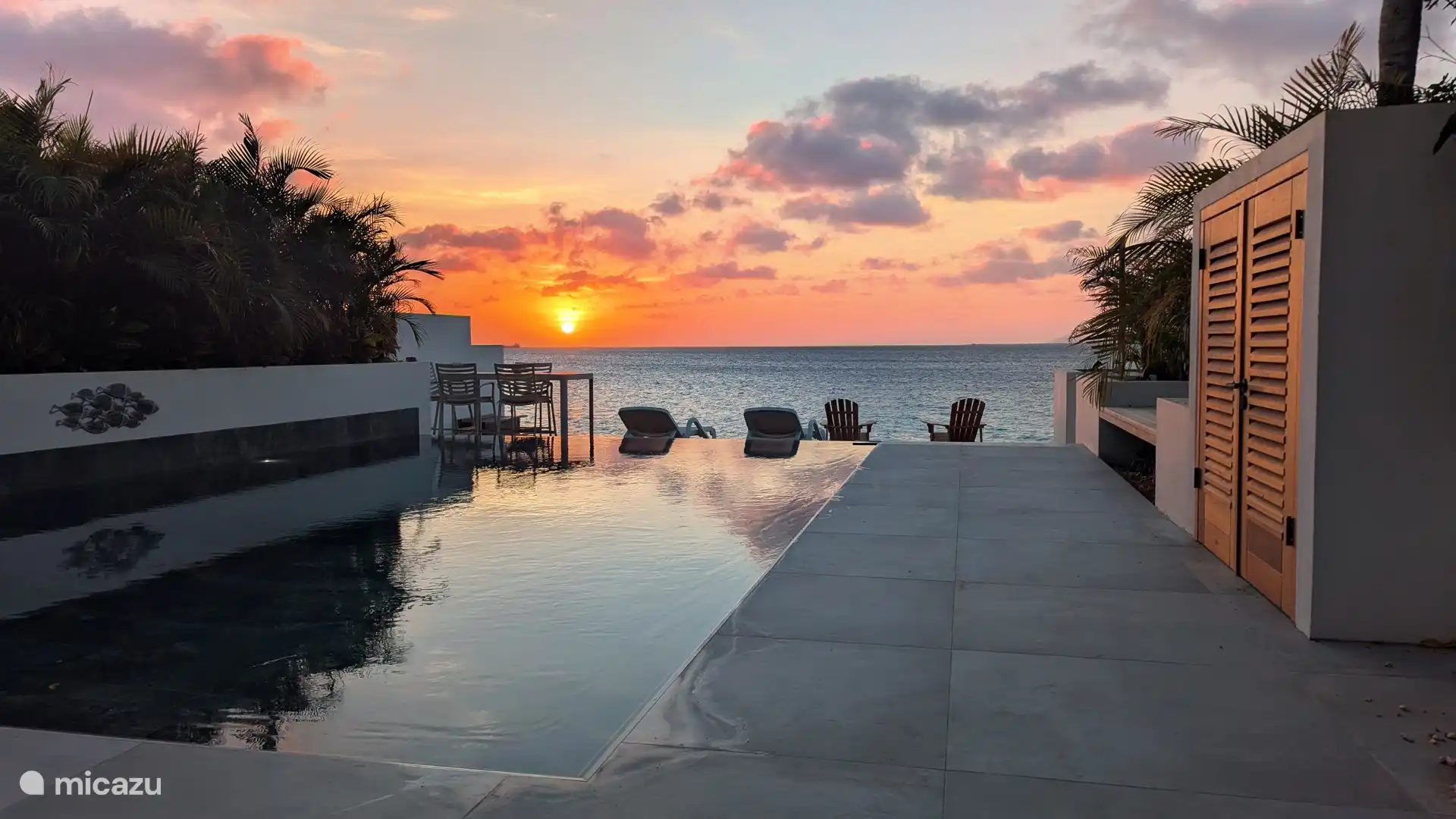 Pool and sea at sunset.