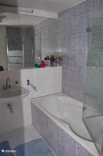 En suite bathroom with bath