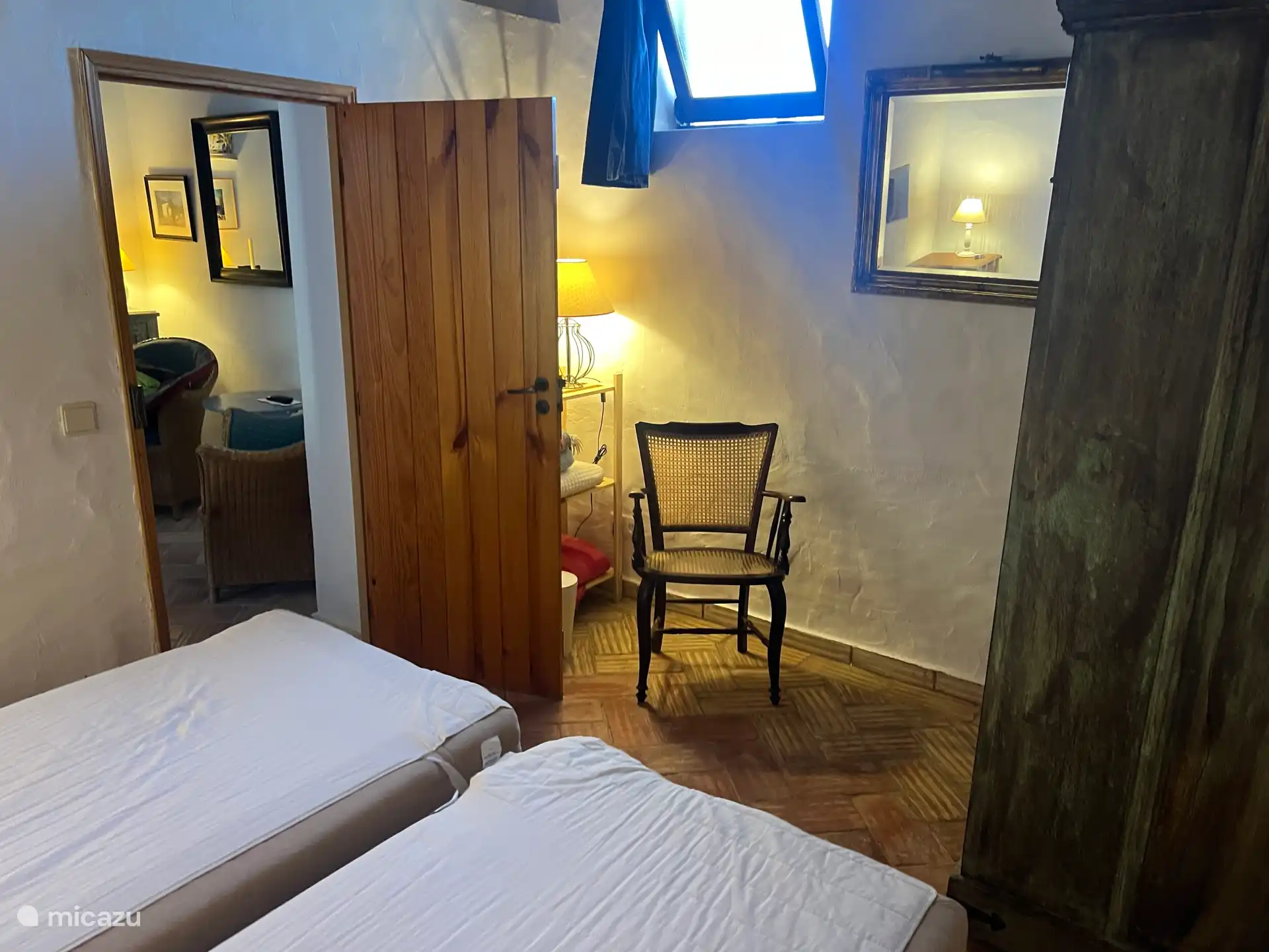 The second bedroom seen from the outside door. On the left the passage to the TV room.
