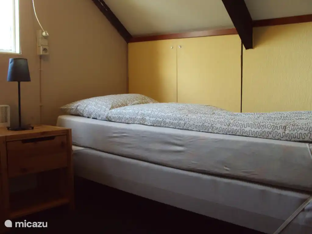 1st floor bedroom has two 1-person box springs.