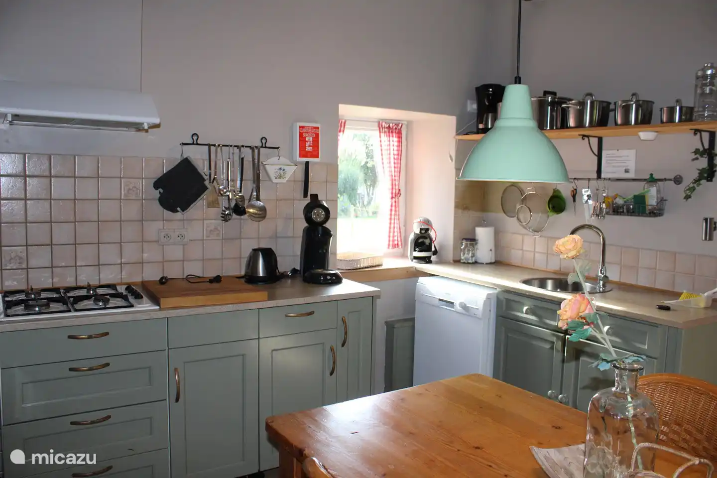 The kitchen consists of a cooking area and a washing-up area with dishwasher 