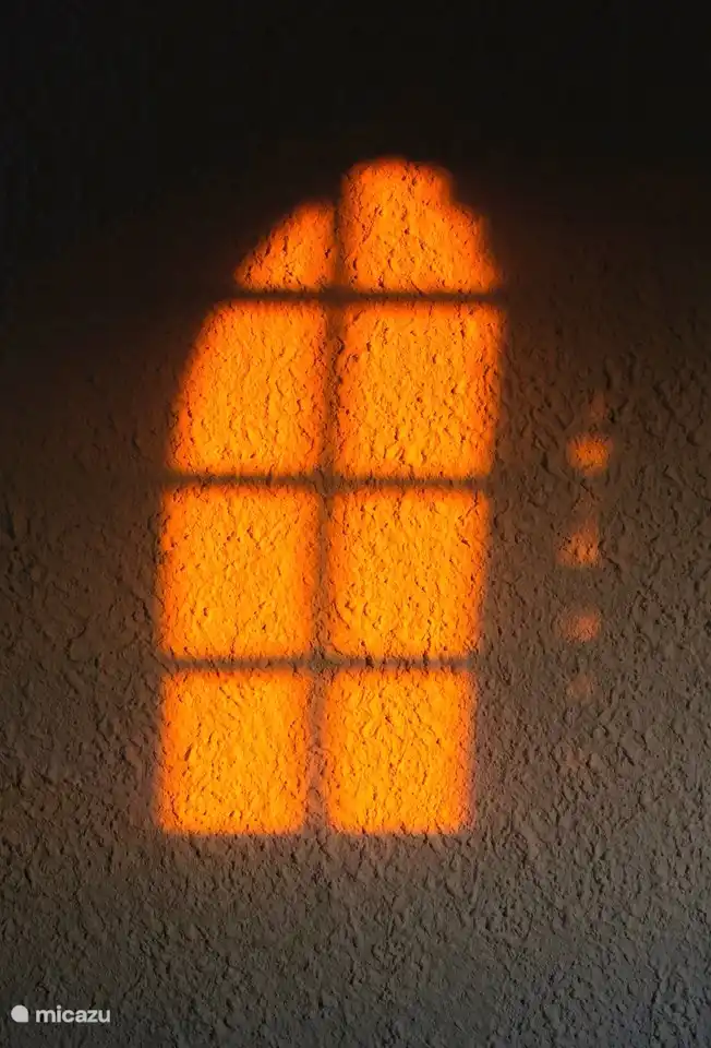 Early joints see the sun reflecting off the plastered wall.