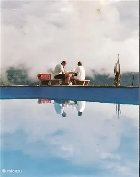 The swimming pool. This precious photo is from the early years. Now there is the plane tree at the seat. Furthermore, the view is just as breathtaking and soothing.