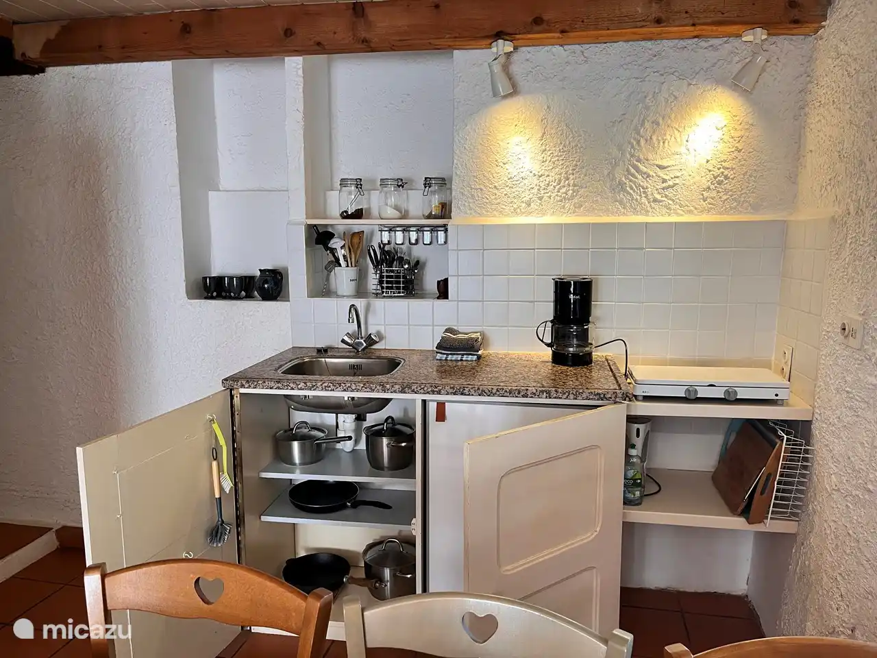 All pots and pans for lunch, brunch and simple supper. The refrigerator on the right.