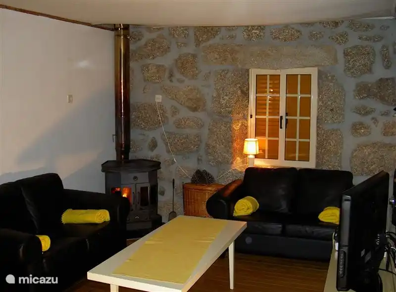 Living room with fireplace for those chilly winter months. Flat-screen TV with English Channels