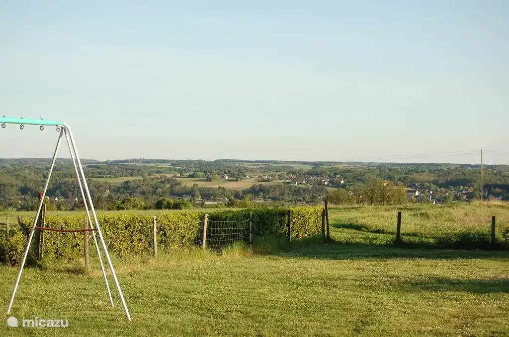 View from the grounds with playground by the pool