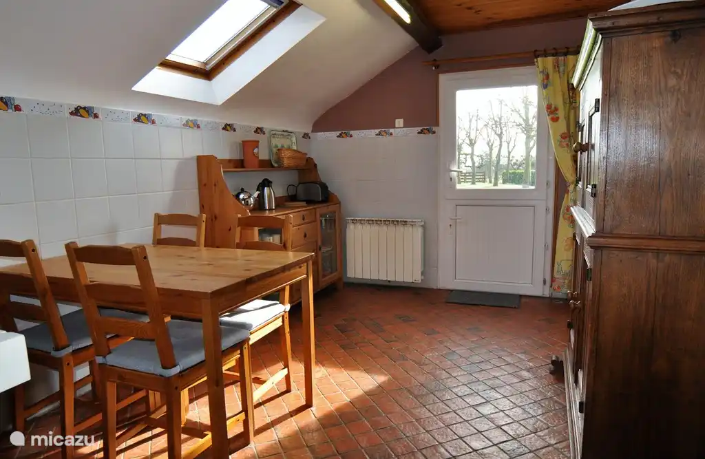 View into the kitchen with breakfast table.
