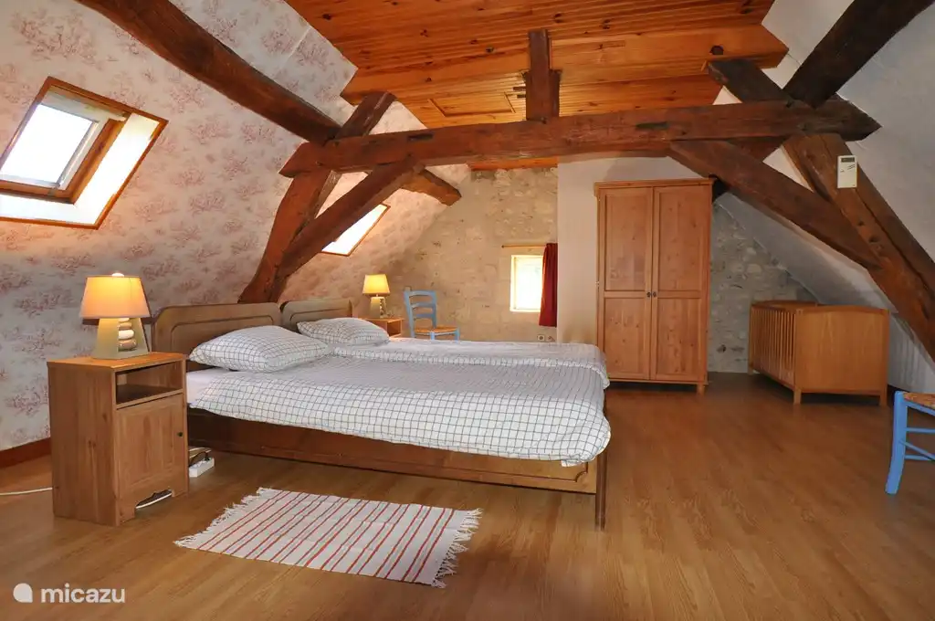 One of the two bedrooms upstairs, each with two single beds (2.10 x 90 cm).