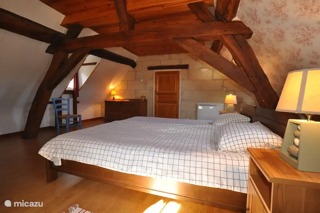 One of the two bedrooms upstairs, each with two single.beds (2.10 x 90 cm).