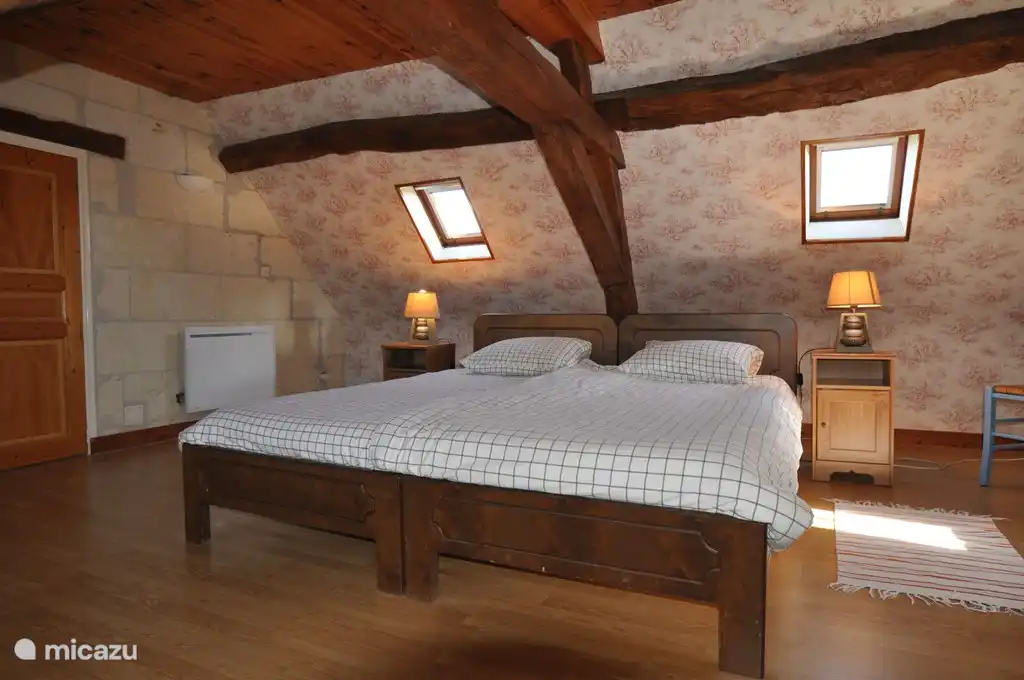 One of the two bedrooms upstairs, each with two single beds (2.10 x 90 cm).
