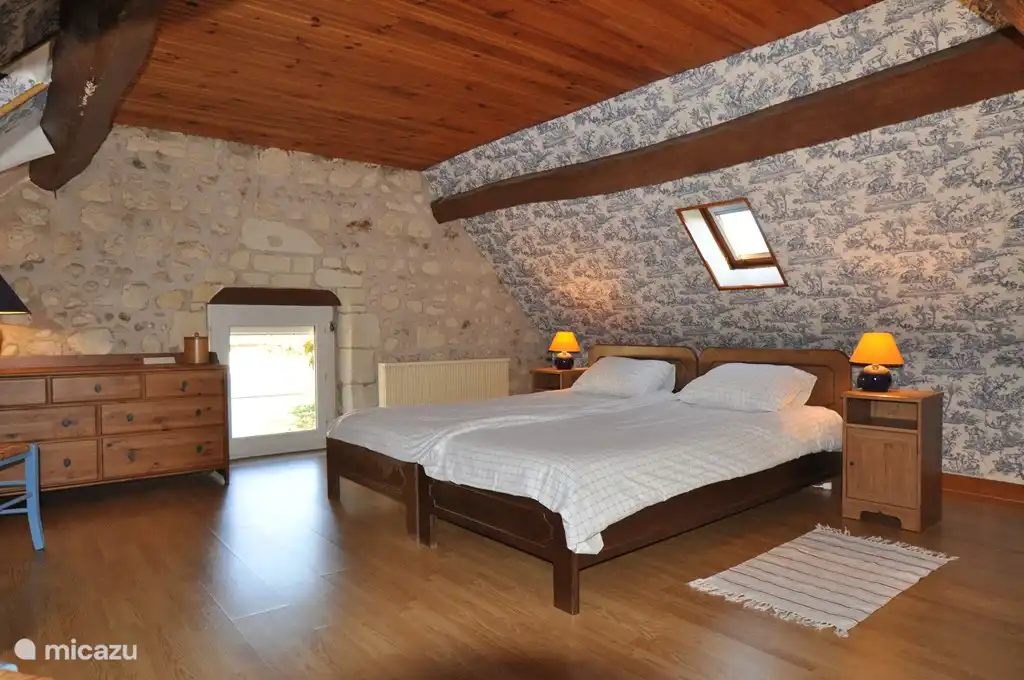 One of the two bedrooms upstairs, each with two single beds (2.10 x 90 cm).