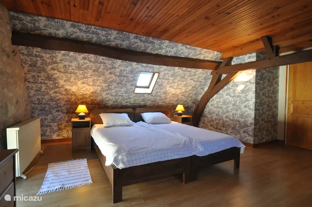 One of the two bedrooms upstairs, each with two single beds (2.10 x 90 cm).