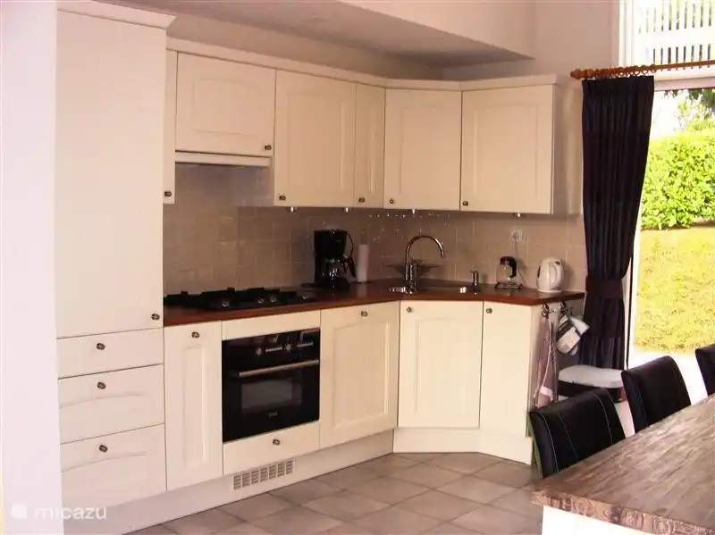 Modern kitchen + dining area