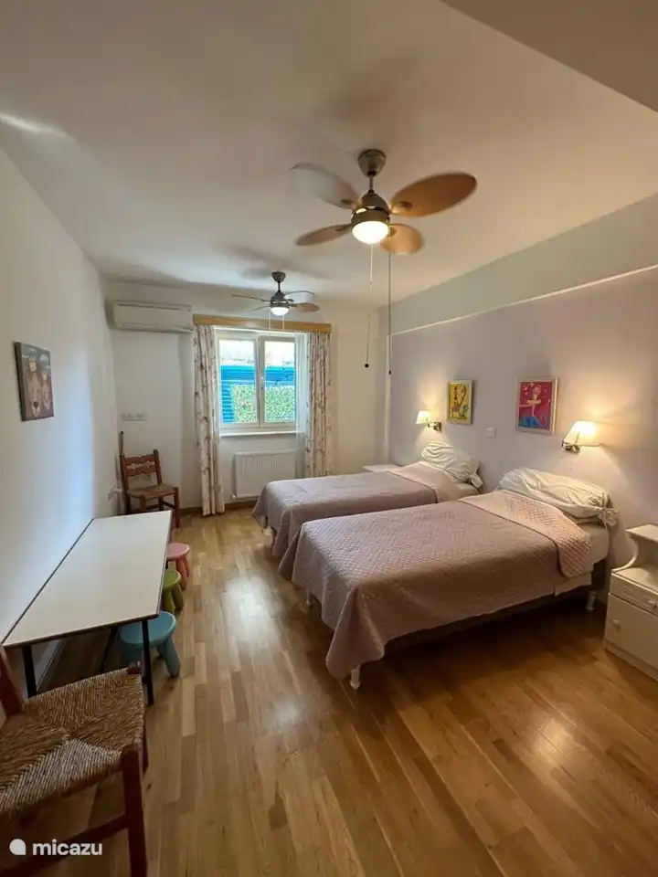 Another spacious bedroom, this one has twin beds.