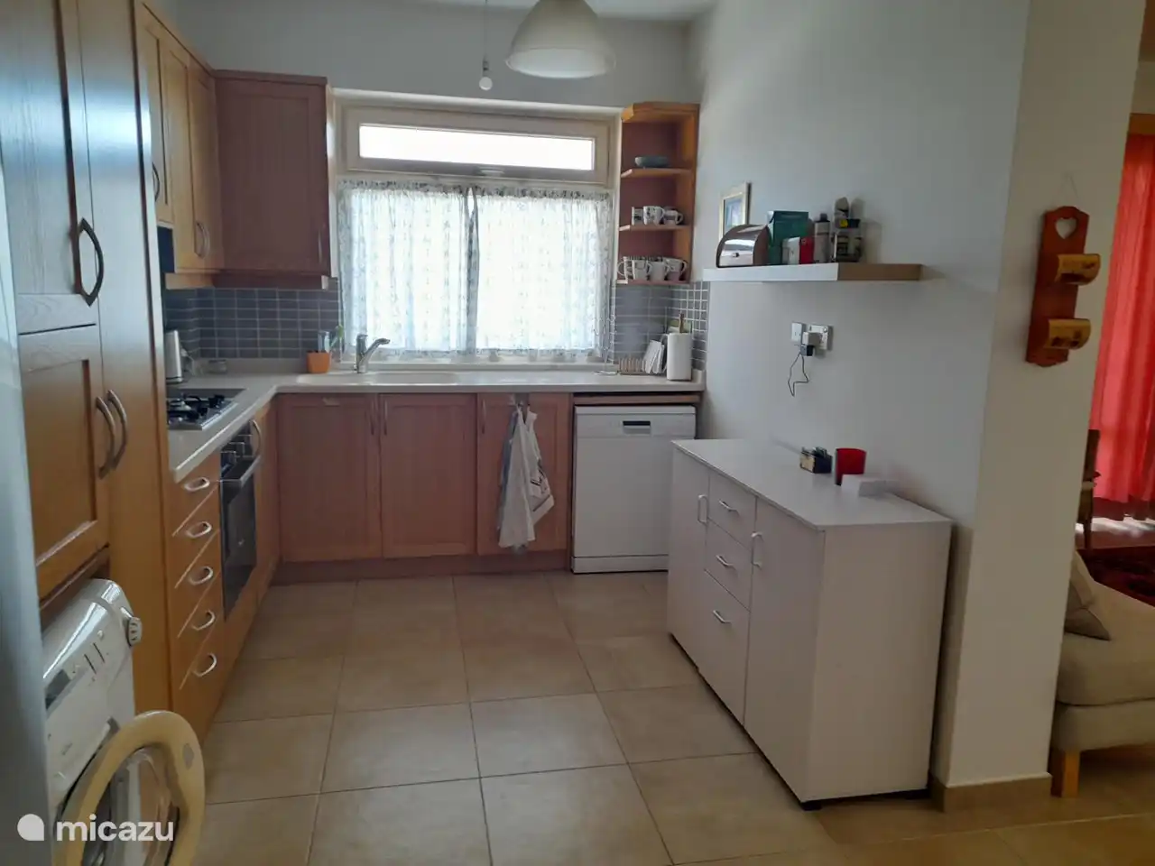 The kitchen is fully equipped with a large refrigerator/freezer, coffee maker, dishwasher, microwave.