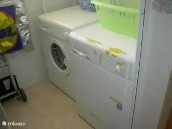 Separate laundry room with washer and dryer