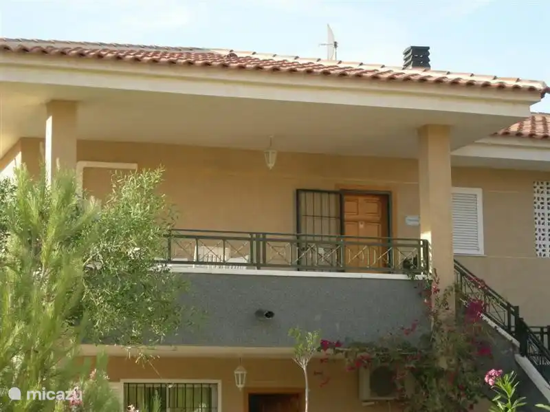 Front house with beautiful tiled roof, no flat roof, porch and on the other hand the beautiful roof terrace