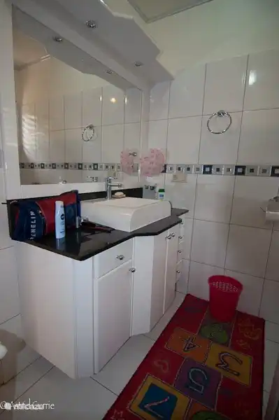 Also in the bathroom a handy table and large mirrors.