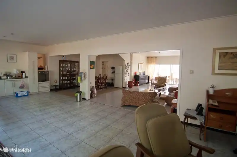 The dining room opens into both the living room and the kitchen. Those three rooms together form a whole, so you don't feel trapped. You really have plenty of room to move.