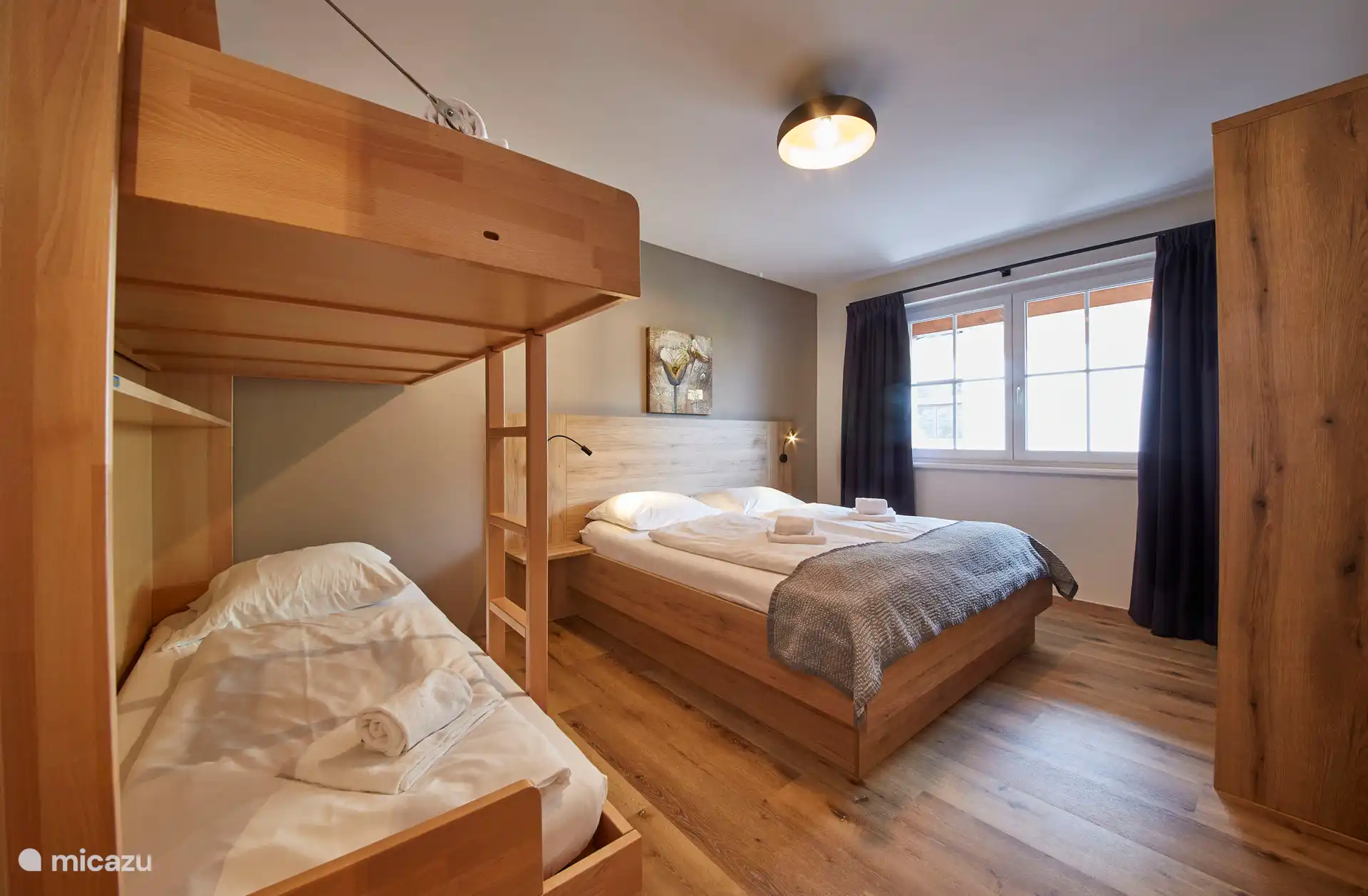 4 person bedroom with twin beds and hotel quality bunk beds