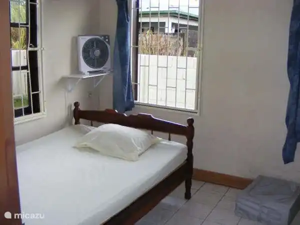 Bedroom 1 with either air conditioning or fan with timer.