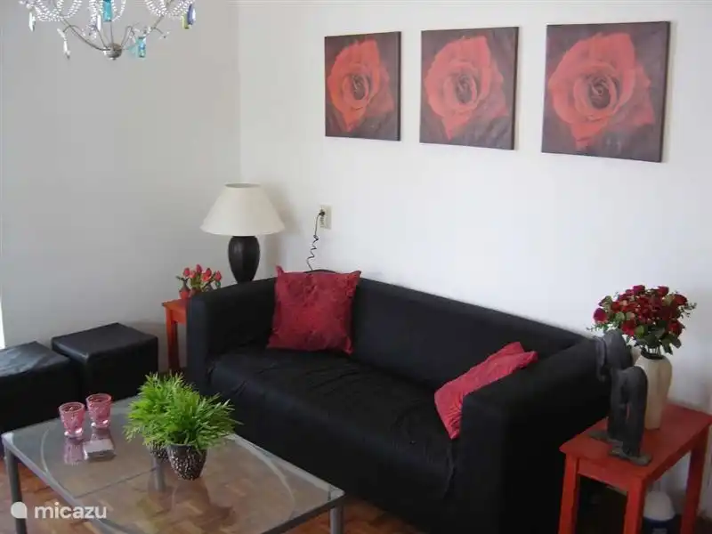 living room with parquet flooring, modern seating and color TV