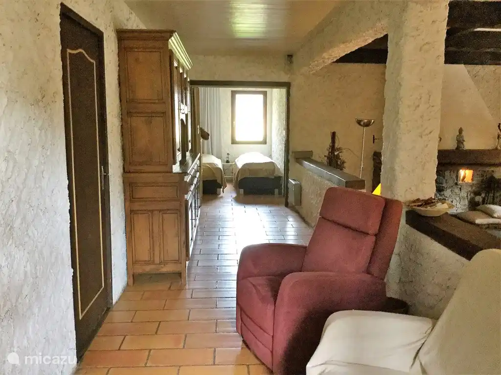 Photo taken from the TV corner to the small bedroom with 2 box springs, left the kitchen door.