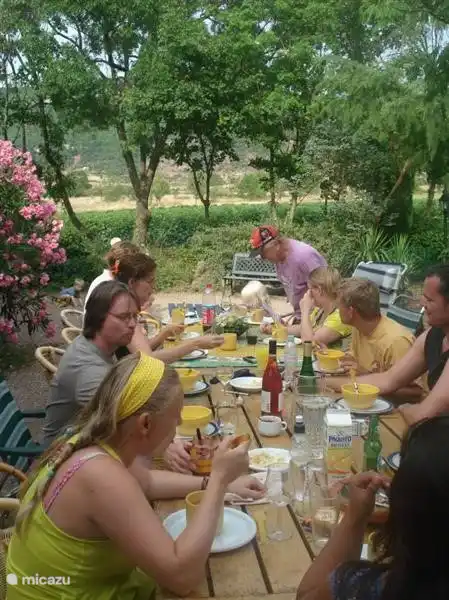 Large wooden dining table outside.
This place is in summer the center of everything. Here, breakfast, coffee and wine drinking, eating, etc. The parasol and Albizia (beautiful tree) give the necessary shade. Sometimes we too the wine tastings and floral workshops.