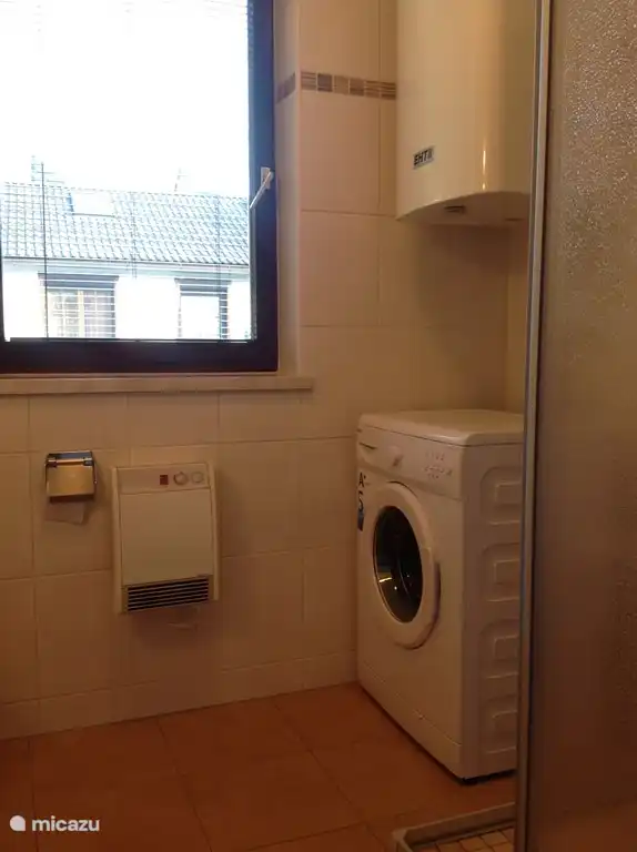 Washing machine in bathroom (both bungalows).