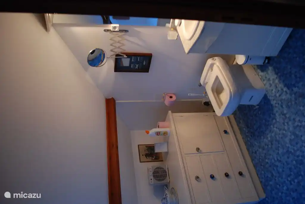 bathroom with bath and sink under the attick