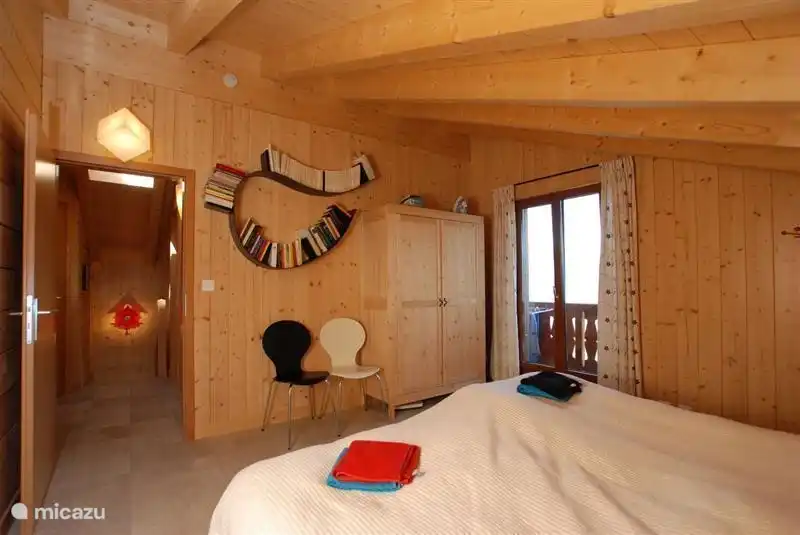 Master bedroom with access to the upper balcony