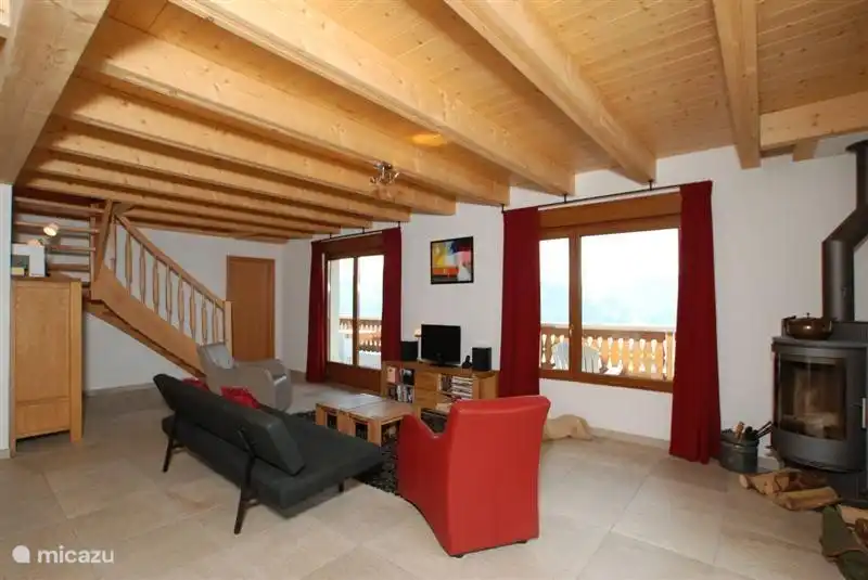 Attractive living room with access to the large balcony and upper terrace