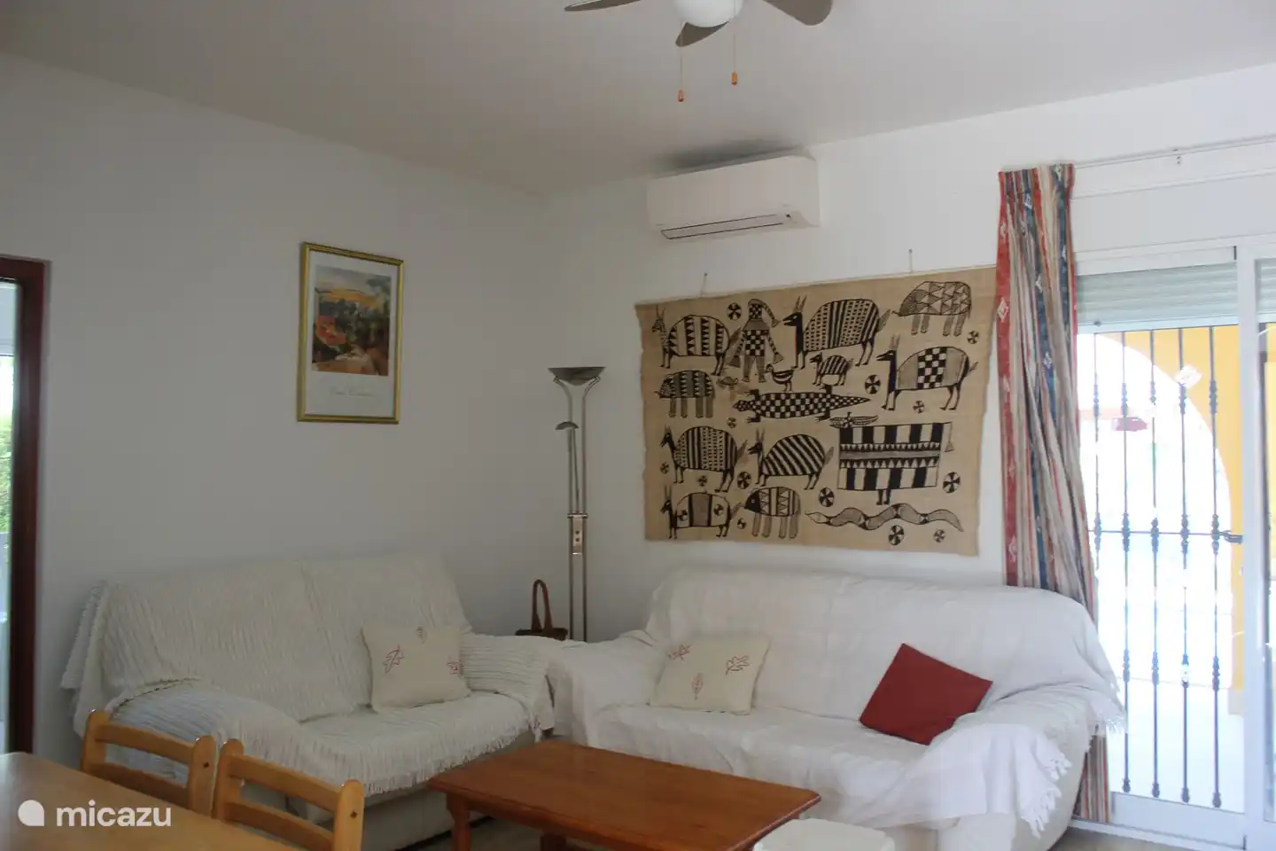 Sitting area with comfortable 2 seater and 3 seater sofa. The living room has air conditioning for both cooling and heating